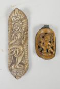 A Tibetan carved and pierced bone pendant with figural decoration in a copper setting, together with