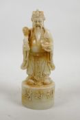 A Chinese reconstituted hardstone mould of an emperor, 8" high