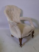 A Victorian walnut open arm, shaped back easy chair, 35" high