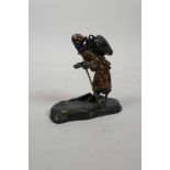 A cold painted bronze figure of a water carrier, 3½" high