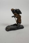 A cold painted bronze figure of a water carrier, 3½" high