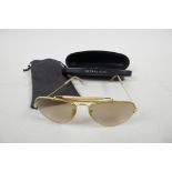 A pair of vintage Ray-Ban USA aviator sunglasses marked 58-14 on the frame, in hard ultralight case