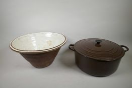 A Le Creuset casserole pot with lid, brown finish, 12" diameter x 6" high, together with a C19th