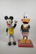 Two painted carved wood cartoon figures, 19½" high