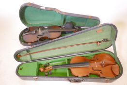 An antique violin and bow in case, 23½?, back 14", and another in a pine case, 23½? x 14½? back