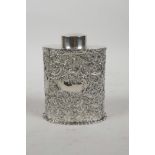 A hallmarked silver tea caddy with repousse swag decoration, marked Chester 1899, 123g