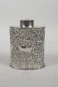 A hallmarked silver tea caddy with repousse swag decoration, marked Chester 1899, 123g