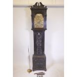 An C18th eight day long case clock with carved decoration, the brass dial with gilt spandrels, the