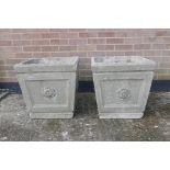 A pair of large square form concrete planters with rosette decoration, 20" x 20", 20½" high