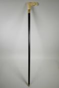 A walking stick with sectional bone handle, carved in the form of an elephant's head, 36" long