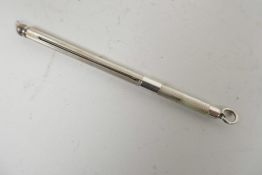 A hallmarked silver swizzle stick with engine turned decoration, maker's mark W.M. (hallmarked