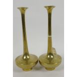 A pair of Chinese brass long necked specimen vases having engraved decoration of dragons, 8½" high