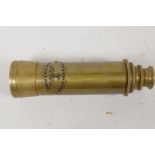 A brass cased three draw telescope marked Zeiss Germany, 6" long closed