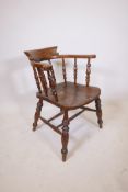 A C19th smokers bow armchair with an elm seat, 32" high