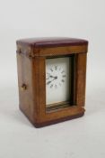 A French brass cased carriage clock and fitted travel case, crack to glass side panel, clock 3" x