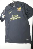 A black 'dry fit' Barcelona football club shirt, 'Messi 10', signed, size 'S'