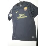 A black 'dry fit' Barcelona football club shirt, 'Messi 10', signed, size 'S'