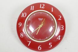 A Smiths 'Selectric' red enamelled electric wall clock, c1950s, 8" diameter