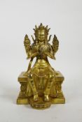 A Sino Tibetan filled gilt bronze of Buddha seated on a throne, impressed double vajra mark to base,