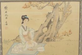 A Chinese watercolour on silk of a young girl beneath a tree, signed with calligraphy and red seal