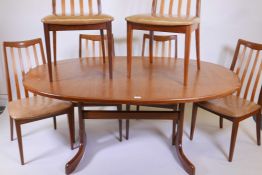 A G-Plan 'Fresco' teak extending dining table and six chairs by Victor Wilkins, 64" x 42", 28½" high