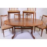 A G-Plan 'Fresco' teak extending dining table and six chairs by Victor Wilkins, 64" x 42", 28½" high