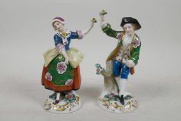 A pair of continental porcelain figures of a dancing girl and boy, 5½" high, minor losses