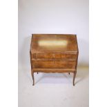 An early C20th Swedish birch veneered bureau with a fitted interior over two long drawers, 35" x 18"