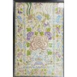 An antique Chinese silk embroidery of flowers and exotic creatures, 10" x 16", framed as a tray