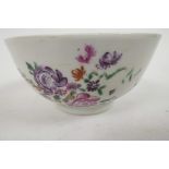 An C18th Chinese porcelain rice bowl painted with flowers and insects in bright enamels, 4" diameter