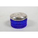 An Art Nouveau style blue glass and sterling silver topped trinket box, the lid with repousse