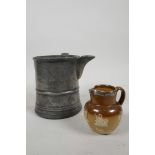 An C18th pewter tankard repurposed to a jug in the mid C19th and belonging to Edwin Faux, landlord