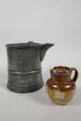 An C18th pewter tankard repurposed to a jug in the mid C19th and belonging to Edwin Faux, landlord