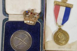 A King Edward VIII Coronation medal together with a bejewelled gilt crown brooch and a Hong Kong