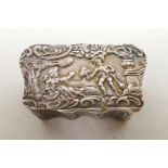 A C19th Continental sterling silver pill box, with ornate repousse decoration and gilt interior,