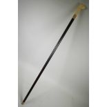 A sectional bone handled walking stick in the form of a dog's head, 39" long
