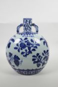 A Chinese blue and white porcelain two handled moon flask with fruit decoration, six character