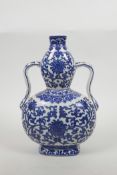 A Chinese blue and white porcelain two handled double gourd flask with lotus decoration, seal mark