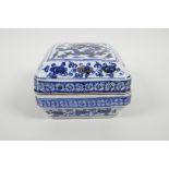 A Chinese blue and white porcelain box and cover with dragon decoration, 7" x 7"