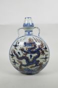 A Chinese blue and white porcelain two handled moon flask with dragon decoration, six character mark