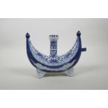 A Chinese blue and white porcelain crescent moon shaped powder flask with floral decoration, 4