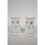 A pair of early C19th Meissen style scatter flower vases, gold edged, no marks to base, one damaged,