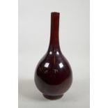 A Chinese flambe glazed porcelain bottle vase, six character mark to base, 10½" high