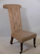 An early C19th prie dieu chair, raised on carved rosewood supports with brass castors