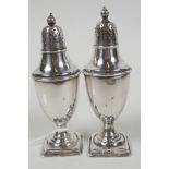 A pair of classical urn style hallmarked silver salt and pepper pots, hallmarked Sheffield 1900,