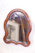 A late C19th shaped wall/easel mirror with laburnum inlaid decoration, bronze beading and original