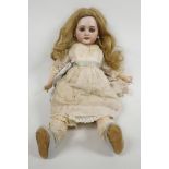 A late C19th bisque head DEP 6 Jumeau doll, with pierced ears, wooden jointed body and shoes, signed