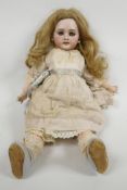 A late C19th bisque head DEP 6 Jumeau doll, with pierced ears, wooden jointed body and shoes, signed