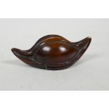 A carved hardwood snuff mull in the form of a nut kernel/gourd, 4½" long