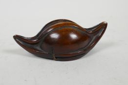 A carved hardwood snuff mull in the form of a nut kernel/gourd, 4½" long